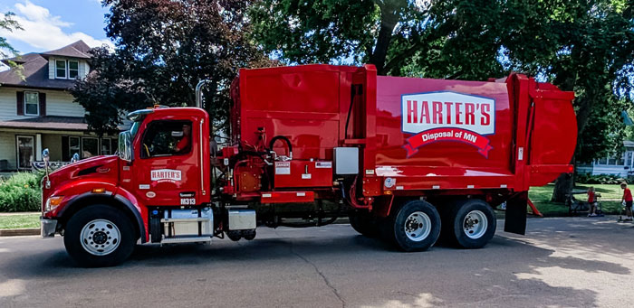Red Harters garbage truck trash service Green Initiatives​